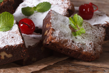 Delicious chocolate brownie cake with nuts closeup horizontal