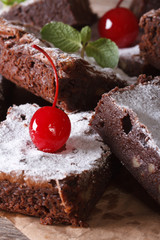 delicious chocolate cake brownies with nuts and cherries macro