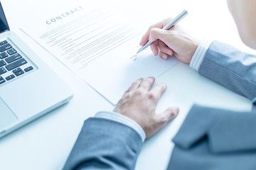Business man signing a contract
