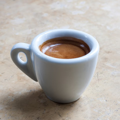 Espresso cup on the vintage stone background. Coffee.