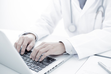 Close-up of a medical worker with laptop