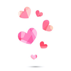 Pink origami heart on white backdrop