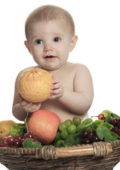 Fototapeta premium Happy little baby girl with fruits on the basket
