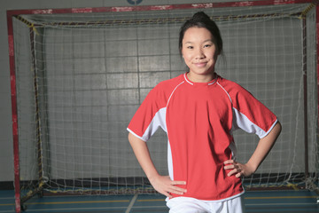 A female soccer player in a stadium