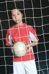 A female soccer player in a stadium