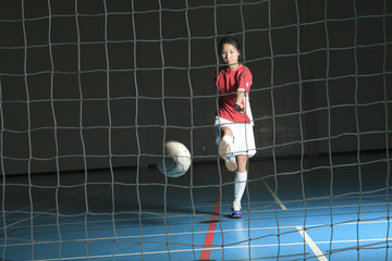 A female soccer player in a stadium