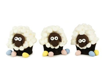 Obraz premium Group of fun spring sheep cupcakes