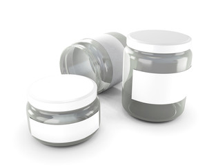 Glass jars of various sizes isolated on white background