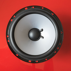 Speaker unit on red background