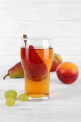 tasty summer drink with fresh fruits, on wooden table