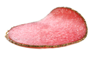 Slice of salami isolated on white background