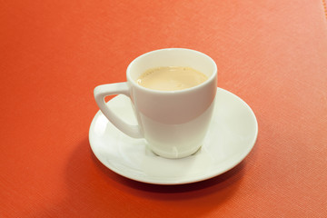 Milk cup on the red background