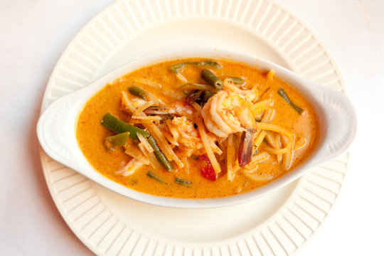 Red curry dish with chicken in Thai restaurant