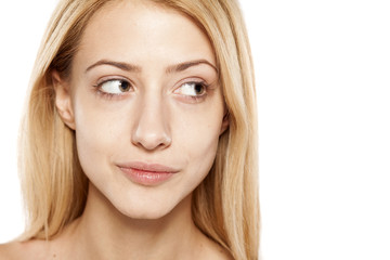 Naklejka premium portrait of positive young blonde without make up