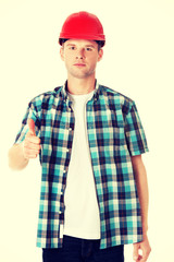 Portrait of a builder in a white helmet