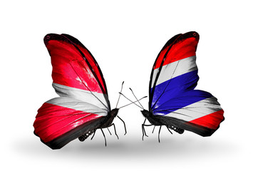 Two butterflies with flags Latvia and Thailand