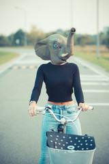 young beautiful brunette straight hair woman using bike