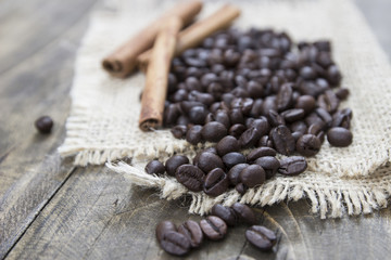 coffee beans and cinamons on the wooden table