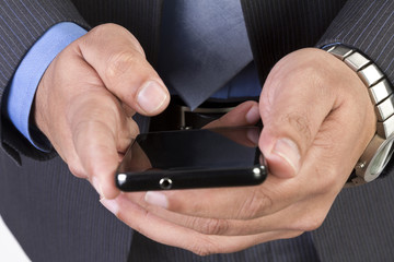Man sending or receiving sms on his smart phone