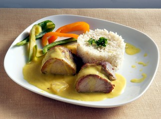 roasted sirloin of pork meat  with curry sauce,rice and peppers