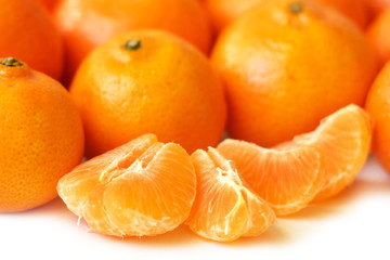 Tangerine slices and whole tangerines