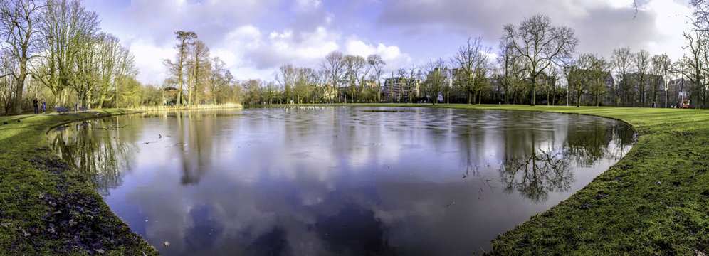 Pond panoramic landscape photo in Vondelpark, Amsterdam. Is a pu