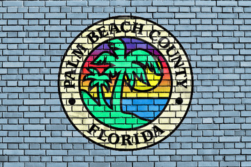 flag of Palm Beach County painted on brick wall