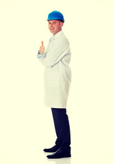 Man in a lab coat and helmet