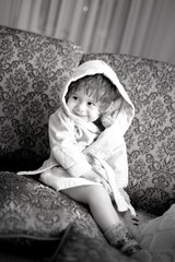 Baby girl in a plush bathrobe