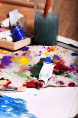 Naklejka na ściany i meble Professional art materials on color wooden background