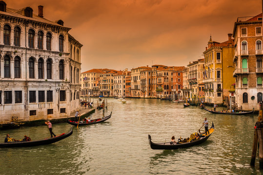 Sunset view of Grand Canal with gondolas in Venice. Italy