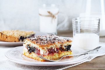 Homemade pies with jam and glass of milk