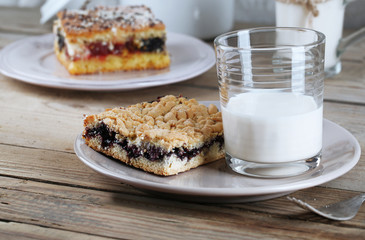 Homemade pies with jam and glass of milk