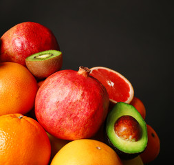 Assortment of fruits on black background