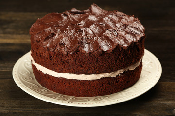 Delicious chocolate cake on table close-up