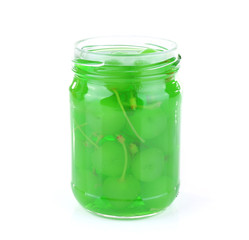 Homemade jar of green maraschino cherry isolated