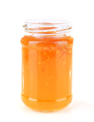 Homemade jar of orange jam isolated on white background