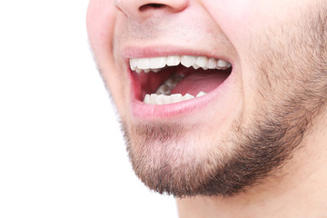 Smiling man after visit dentist isolated on white