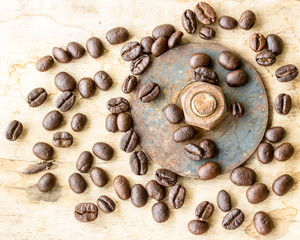 Coffee bean and nuts on grunge wooden background