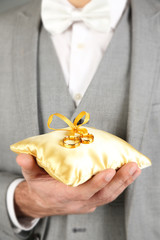 Man holding wedding rings close up