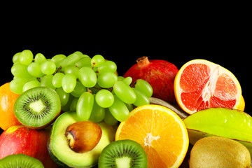 Assortment of fruits on black background