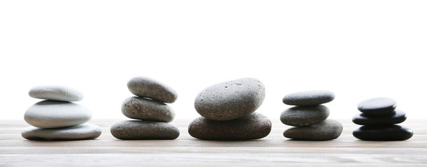 Spa stones on table on light background