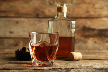 Whiskey on wooden background