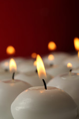 Burning candles on table on dark background