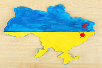 Map of Ukraine with blood - concept of war in the country