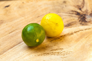 Fresh limes on wooden table
