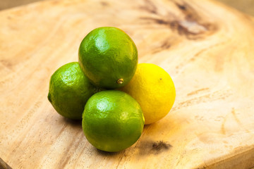 Fresh limes on wooden table