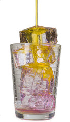 Pouring orange drink into glass full of ice