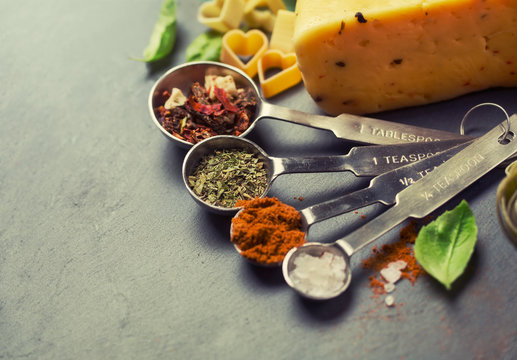 spices  in metal measuring spoons