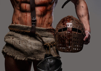  gladiator with muscular body and blood spots